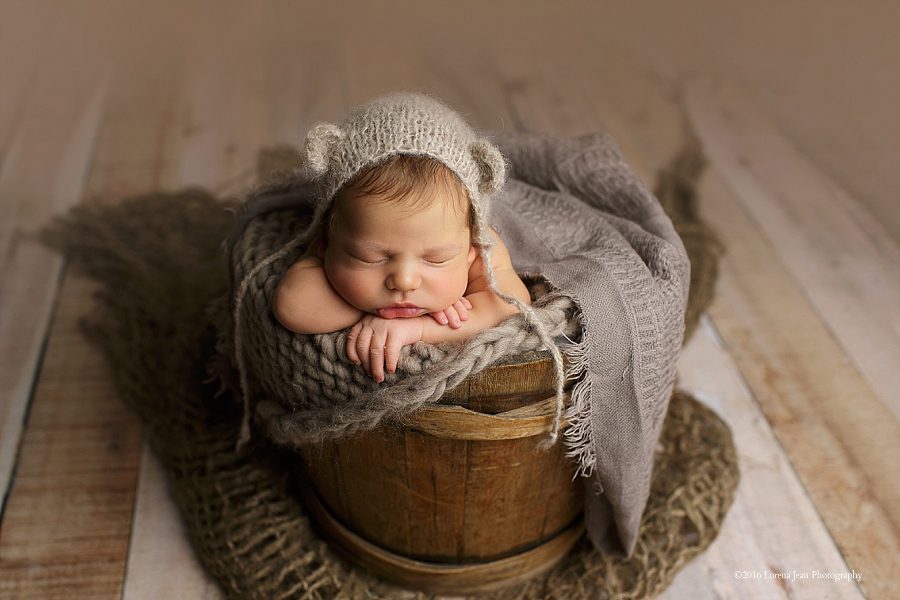 newborn baby in bucket